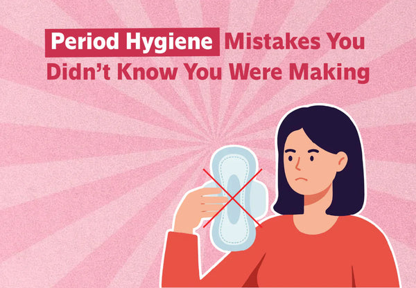 Woman holding a crossed-out conventional sanitary pad - switch to organic sanitary pads to avoid period rashes, cramps and infections